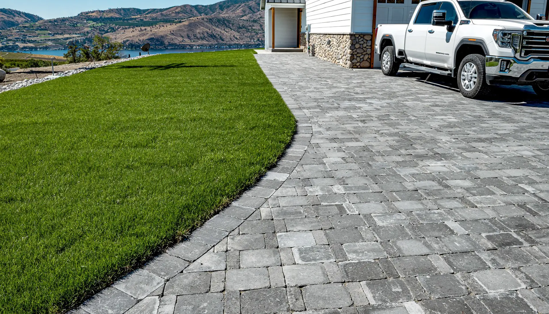 mm-roman-cobblestone-driveway-sits-above-lake (1)